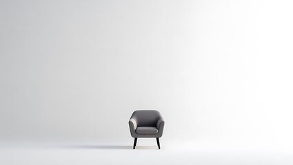 Minimalist gray armchair in a bright white studio space
