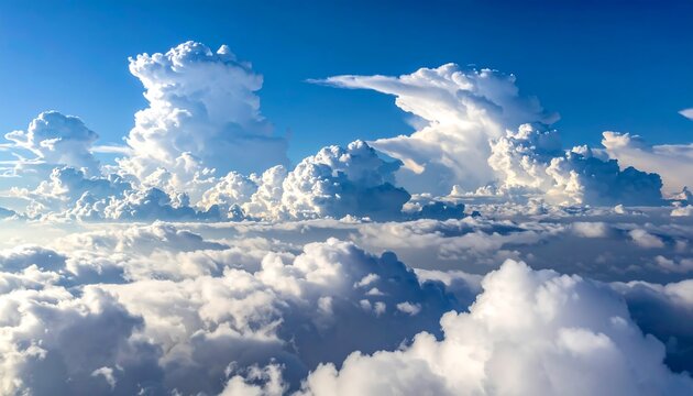High-altitude view of fluffy clouds against a vibrant blue sky