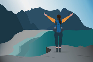 Women climbers standing on a cliff overlooking a front landscape with beautiful mountains and a river.