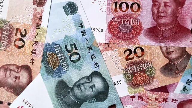 Chinese paper money, yuans in various denominations. China money as a business background for your design