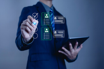 Businessman using digital interface for profile selection and checklist on tablet, symbolizing recruitment, human resources, job application, data management, and modern business technology.