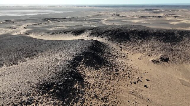 Drone aerial footage of the Eye of the Sahara in Mauritania, also called the Richat Structure. Iconic circular geological formation in the vast desert landscape.