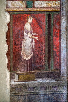 Ruins of Pompeii, Italy. Decoration detail. Fresco painting on the wall of Villa of the Mysteries.
