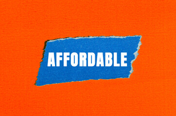 Affordable message written on ripped torn paper background. Conceptual Affordable symbol. Copy...