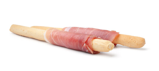 Delicious grissini sticks with prosciutto isolated on white