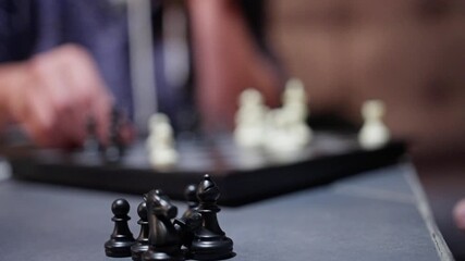 A thrilling chess match that showcases intricate strategic moves and the competitive spirit between two players. Slow motion - Powered by Adobe