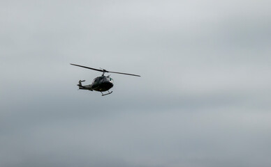 The legendary American military helicopter UH-1 in the clouds