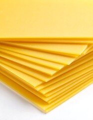Stacked sheets of yellow pasta