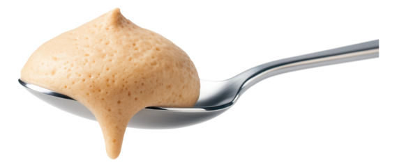 A spoonful of smooth, light brown mousse with a creamy texture, showing a velvety and airy consistency.