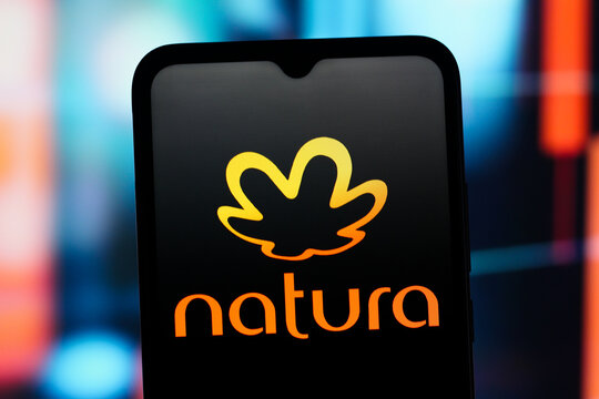 In this photo illustration, the Natura logo is seen displayed on a smartphone screen.