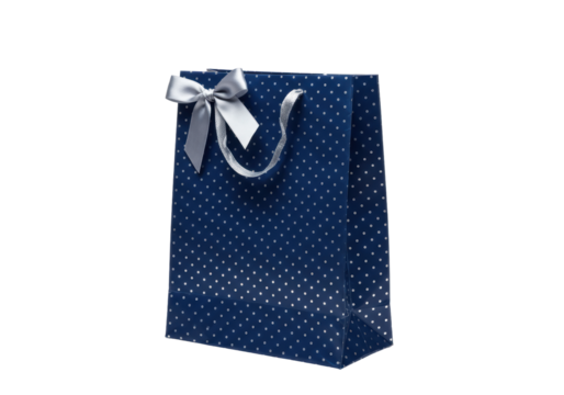 Isolated navy blue shopping bag with silver polka dots and bow for retail and gifts