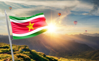 Suriname flag waving in beautiful scenery. Suriname national flag for independence day.