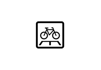 Black icon of bicycle crossing over a road enclosed in square