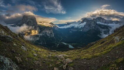 Majestic granite mountains with foggy valleys and golden sunlight