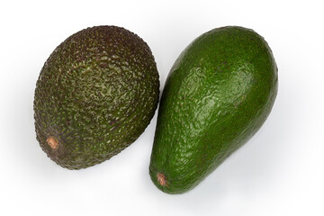 Whole purplish Hass avocado and green avocado on white background