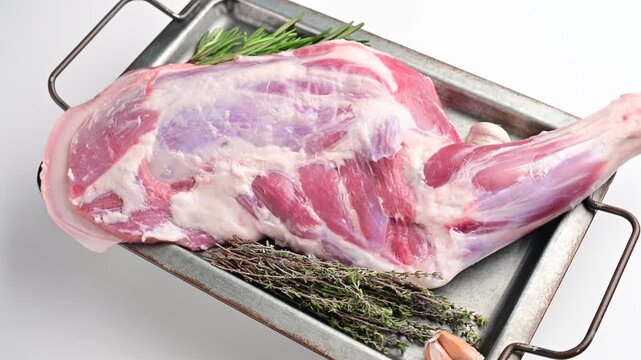 Fresh raw lamb shoulder, leg perfect for slow cooking or roasting to create a tender, flavorful meal.