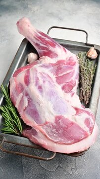 Fresh raw lamb shoulder, leg perfect for slow cooking or roasting to create a tender, flavorful meal.