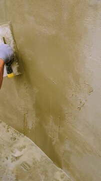 Apply waterproofing to the walls. Selective focus.
