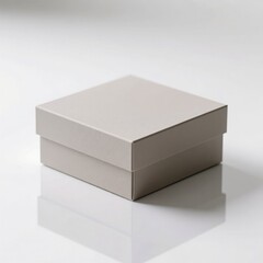Fototapeta premium Closed light gray gift box on white reflective surface, ideal for product presentations