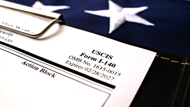 I-140 Immigrant petition for alien workers blank form lies on American Flag background