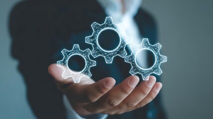 Businessman holding three glowing digital gears in his palm cogwheel mechanism