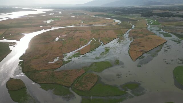 Afghanistan Aerial Drone over wetlands Nature Landscape Of river delta Stream Branches Of The Kunar River In Nangarhar Province, Nuristan