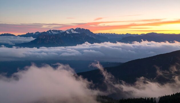 Mountain sunrise through clouds