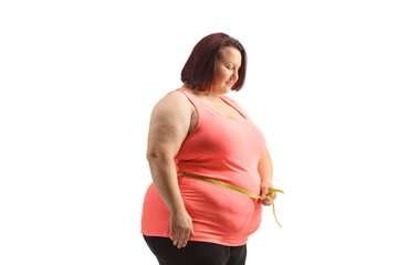 Overweight woman measuring her waist