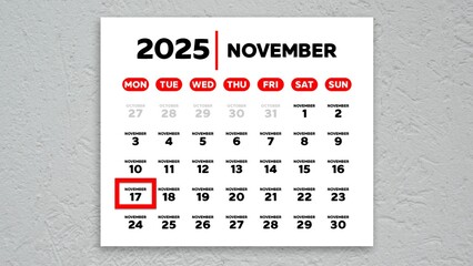 The date November 17th marked with a red cursor on the wall calendar 2025