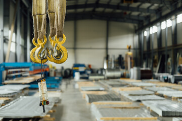 The production warehouse area of a factory for processing rolled metal into building materials (for example, corrugated board, metal tiles, siding)
