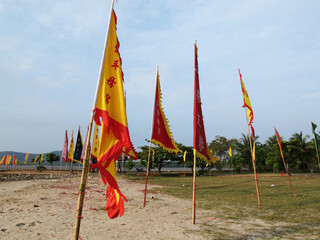 Yantra Prayer flags or vegetarian bunting flag on beach for Thai traveler people pilgrim blessing respect praying chinese deity angel god at Vegetarian Festival on October 20, 2012 in Phuket, Thailand