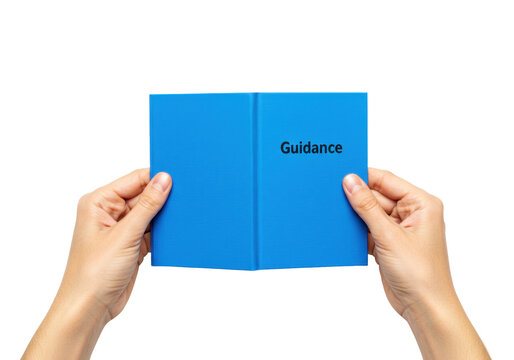 Isolated book with the title Guidance is open and being held by two human hands
