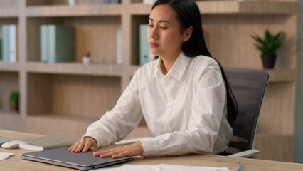 Upset Asian sad businesswoman female disappointed Japanese worker business woman employer end job finish networking typing laptop closing computer pc done working holding head headache pain in office