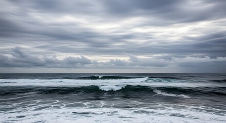 Fototapeta premium powerful ocean waves under a dramatic grey sky