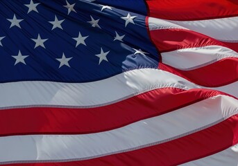 Obraz premium Close-up of the American flag waving proudly in the wind, a symbol of freedom and patriotism
