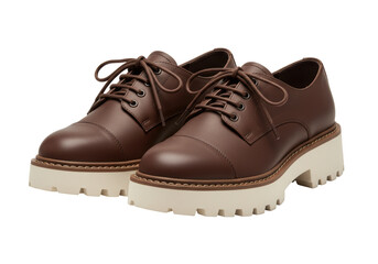 Isolated pair of brown leather platform shoes or boots with thick lug sole and laces