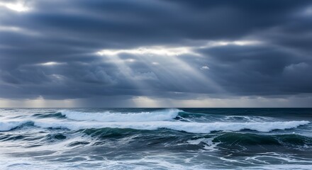 Fototapeta premium dramatic ocean waves stormy sky sun rays