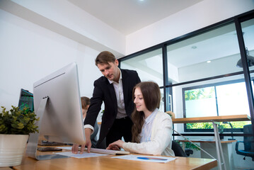 Collaborative meeting in modern office setting with three professionals discussing project. atmosphere is focused and productive, showcasing teamwork and communication.