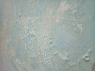 Damp and moldy wall. Peeling of paint and swelling of the wall from excessive moisture. Water is leaking out of the wall.
