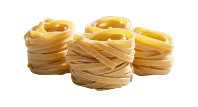 Trio of dry, nested nests of uncooked tagliatelle pasta