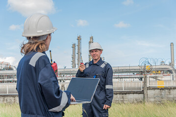 Female engineer using laptop on site outdoor for project