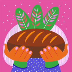 Woman holding a fresh loaf of bread with green leaves in the background. Concept of homemade baking and natural healthy eating.