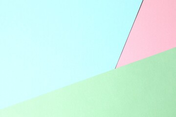 Blue, pink and green paper background. Abstract design of monochrome paper background