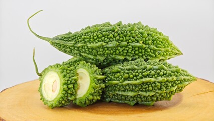 Bitter Melon or Bitter Gourd on Wooden Board.