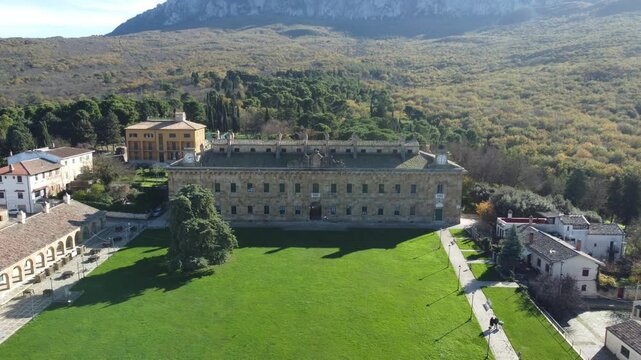Aerial 4k drone footage of Real Casina di Caccia di Ficuzza in Sicily, Italy, showing the historic hunting lodge surrounded by lush forests, rolling hills, and scenic Mediterranean landscapes