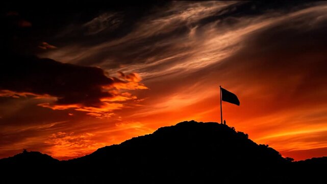 Flag on hill sunset