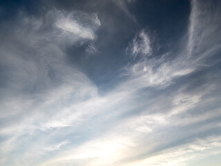 a sky filled with various clouds, ranging from wispy cirrus-like formations 