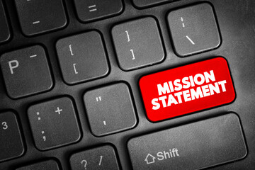 Mission Statement - concise explanation of the organization's reason for existence, text button on keyboard