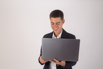 Man in suit holding laptop