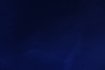 Night starry sky over autumn forest.